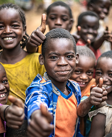 Sudanese kids giving thumbs up