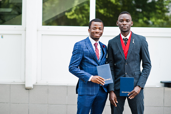 Two young qualified boys smiling and standing